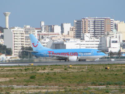 Plane by the city of Faro, Algarve