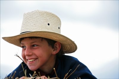 Perched on the hay.