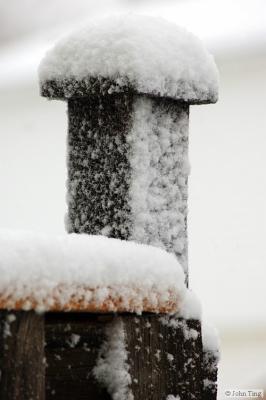 Snow capped post of my back porch