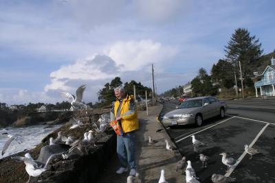 Randy feeding Cheese Puffs to his new best friends in Depoe Bay.