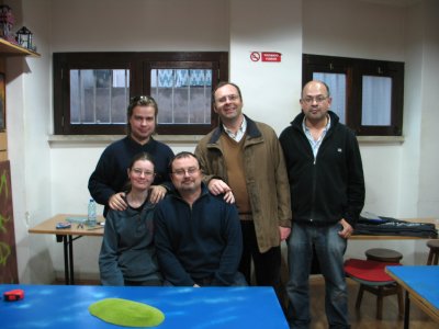 The 4 players and the shop onwer (siting at center)