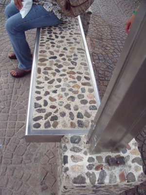 A different kind of bus bench (cobblestone and steel)