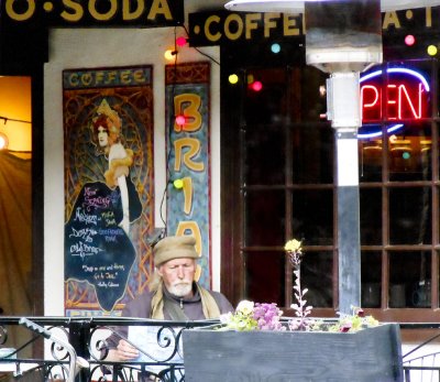 Man reading at tea shop