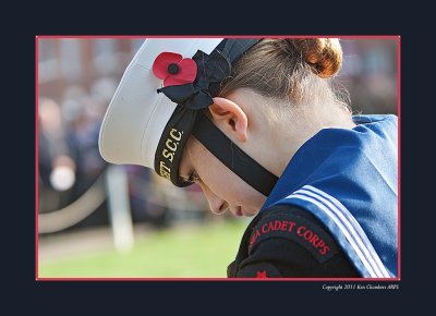 Standing with head bowed 
