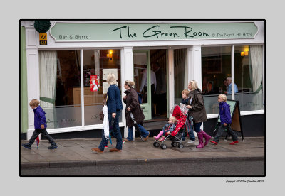 06.45 People hurry past The Green Room, on their way to securing a good viewing place,