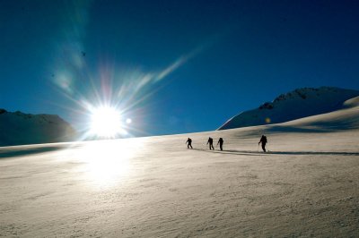 skiers and morning sun