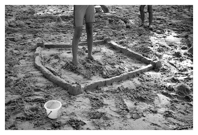 Giant destroying sandcastle