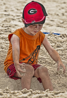 Buring His Feet In The Sand
