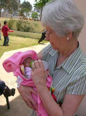 Carol and baby at the orphanage