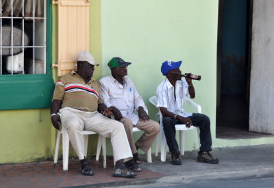 Relaxing outside Speightstown rum house