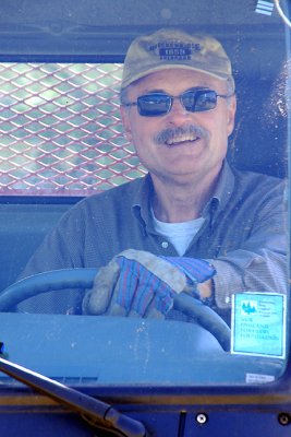 Brigade member Glenn Hammond, as teamster driving dump truck.