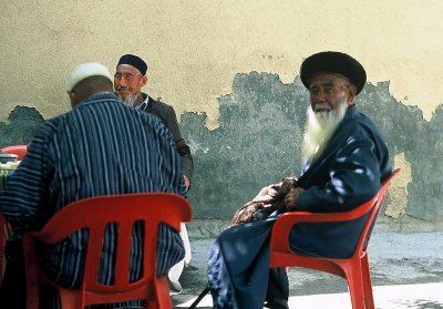 old men chatting at cafe