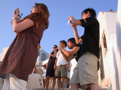 Sunset at Oia, tourists are trying to make their point of view