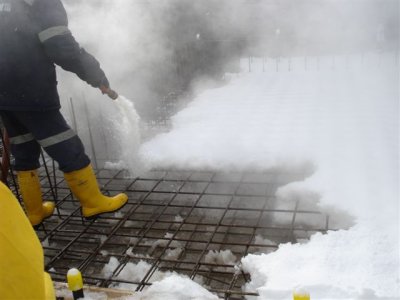Hot water melt of snow before concrete pour (2).JPG