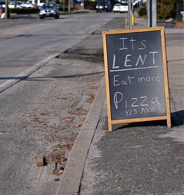 Sign in Front of the Local Pizza Place