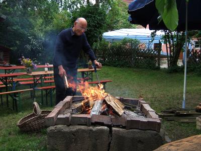 Oskar prepares the fire