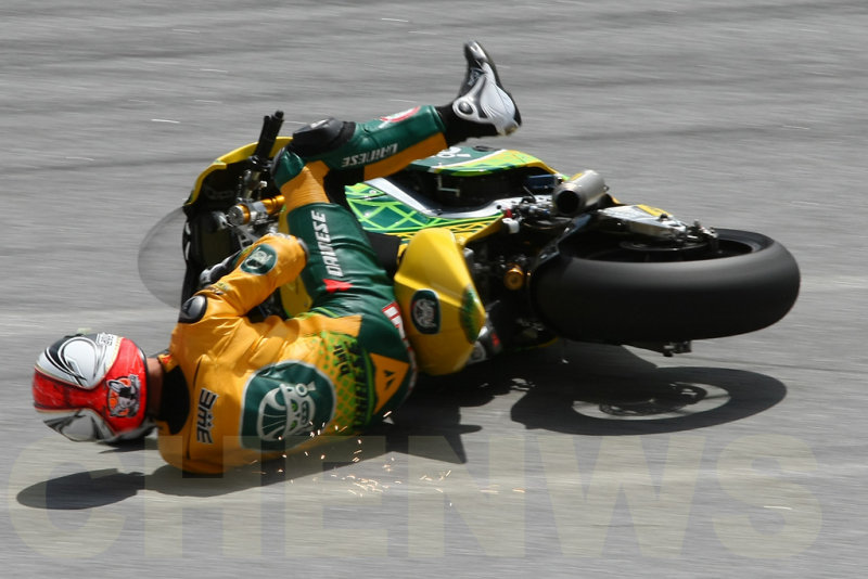 Mattia Pasini falls during practice at the Malaysian Motocycle GP 2011