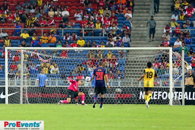 Vito Mannone fails to stop Azmi Muslim scoring Malaysias first goal