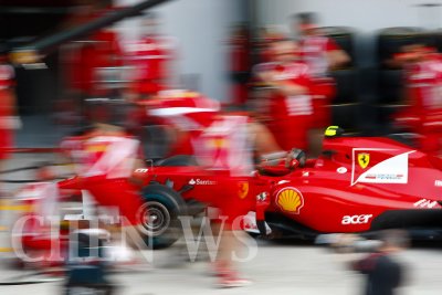 Ferrari's crew practices pit-stop