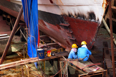 Workers at the dry dock