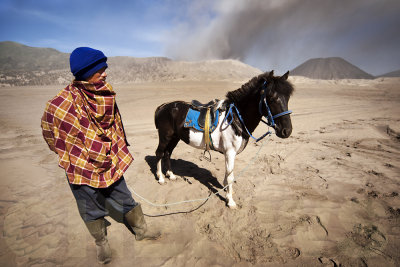 A Tengger and his horse inside the caldera.