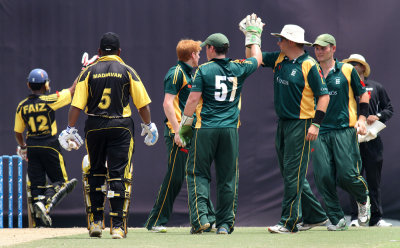 Guernsey players celebrating Madhavans dismissal