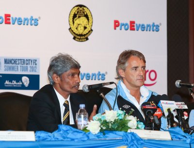 K. Rajagopal and Roberto Mancini at the press conference