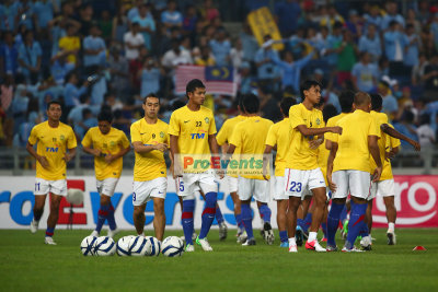 Malaysian XI warming up