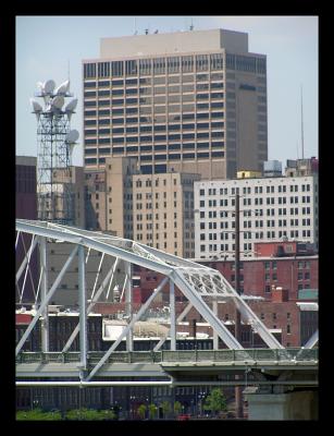The brutalist Amsouth Tower with the Shelby Street Pedestrian Bridge in the foreground