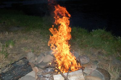 Late fire fun by the river's edge.