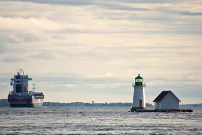 freighter and lighthouse on the St Lawrence