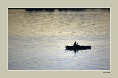 33 - Fisherman meditating in the Nile River