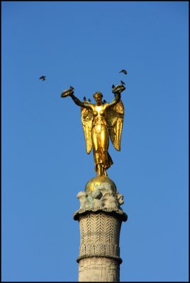 Gold Statue with Pigeons