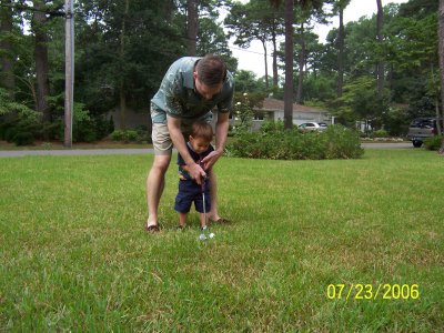 Papa and Evan playing golf