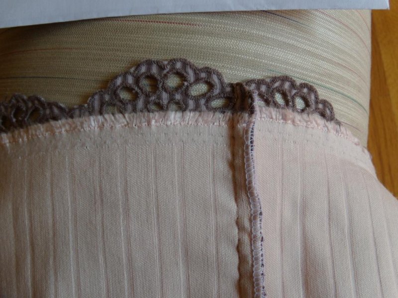 Eyelet Knit Skirt Seam Detail. Lining treated as one with Fashion Fabric.