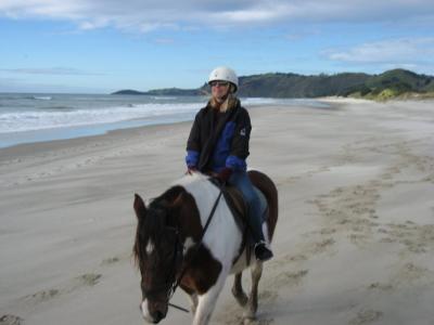 Riding on a deserted beach