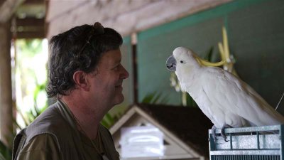 Jim with the cockatoo at Lync-Haven