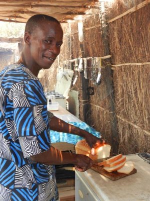 Slicing freshly baked bread for toast