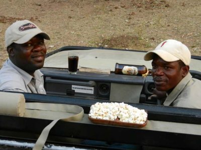 Sundowners on the vehicle (with lions!)