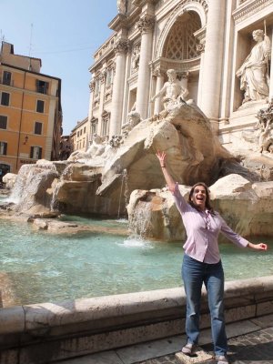 Throwing a coin in the Trevi Fountain (so we'll come back to Rome!)