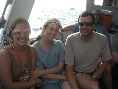 Jess with mom and Jim on the boat out to the dive spot