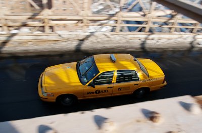 A Yellow Cab on the Brooklyn Bridge
