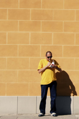 yellow man, yellow wall