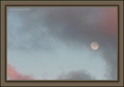 A Passing Full Moon Vignette At Sunset