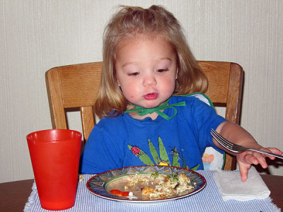 Super-Kristina wears her bib as a cape