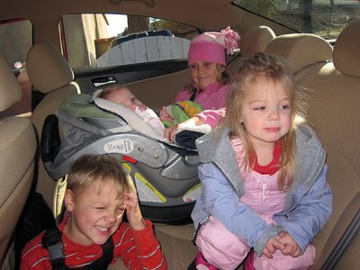 Kids in back seat ready to go