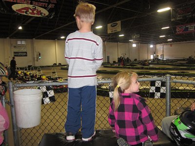 Little kids watch the laps fly by