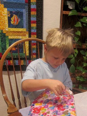 Opening a present carefully
