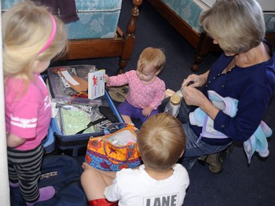 The kids pack Baba's suitcase