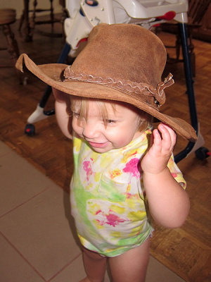 Annie tries a cowboy hat